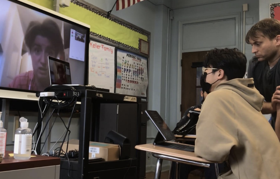 Student Jonathan Lin interviews journalist Kate Abramova, while English teacher David Giunta supervises. Photo provided by David Giunta.